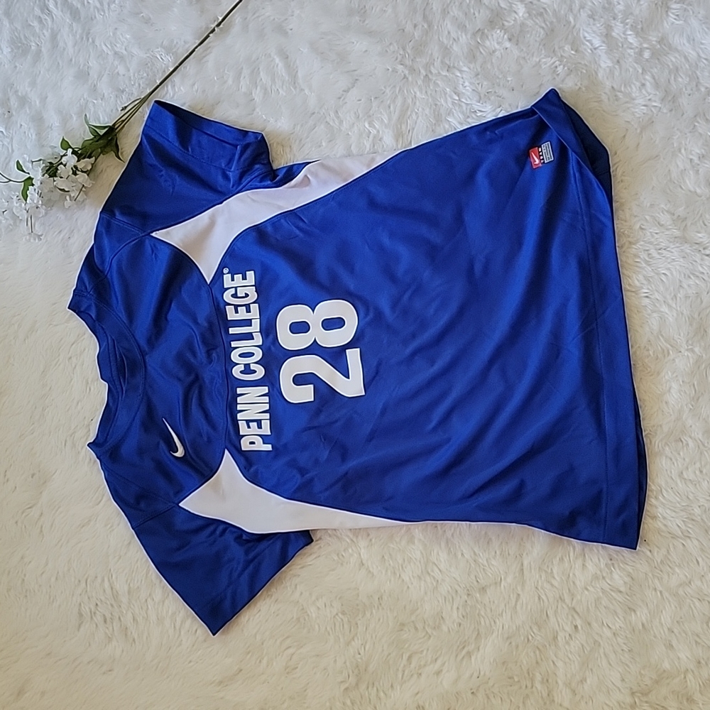 Nike athletic numbered top. 28. Size medium. College.